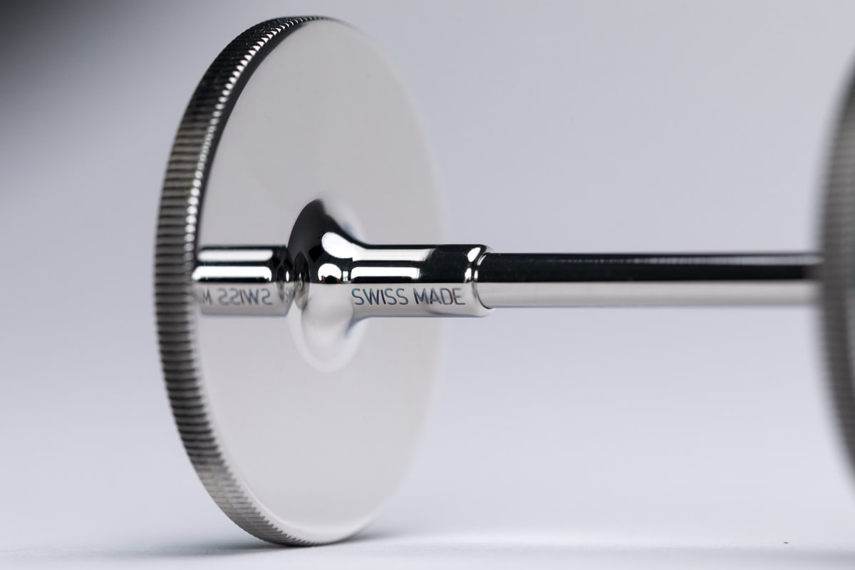 The textured rim, polished body and Swiss-made engraving in close-up
